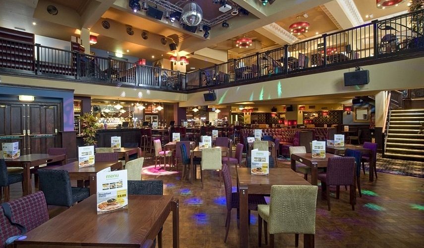 Queens Academy bar and seated area