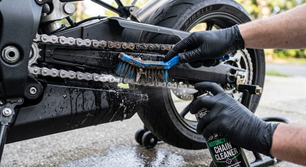 Close up of motorcycle chain cleaning during detailing in Clifton VA Close up of motorcycle chain cleaning during detailing in Clifton VA