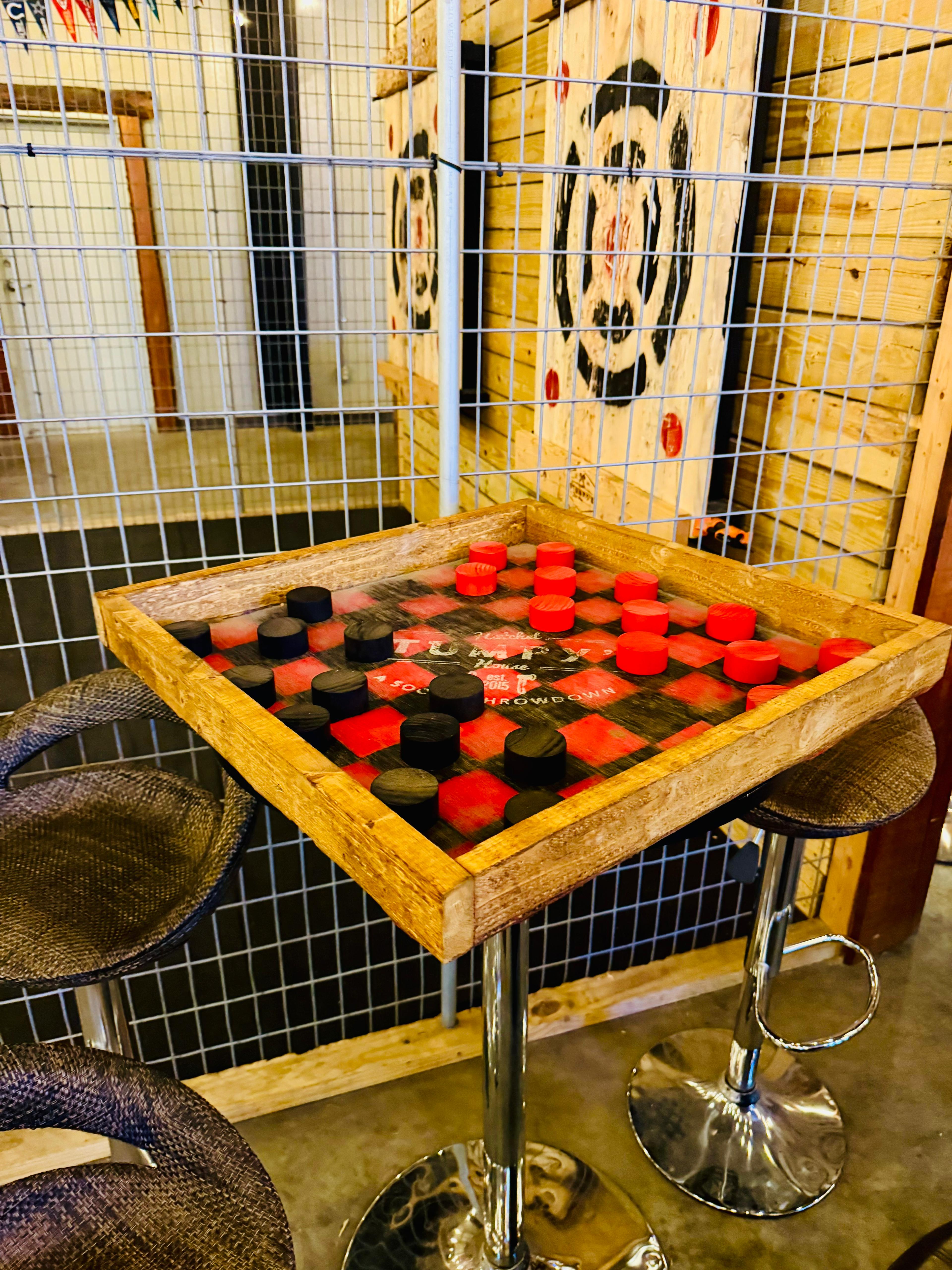 Guests enjoying social games at Tampa Bay Axe Company