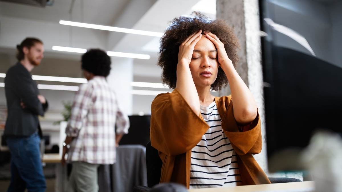 employee feeling overwhelmed and mentally drained in a workplace environment employee feeling overwhelmed and mentally drained in a workplace environment