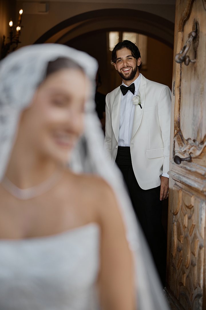 Groom looking lovingly at his bride during a luxury wedding photoshoot in Dubai