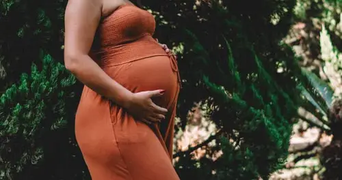 Pregnant person receiving gentle prenatal chiropractic care