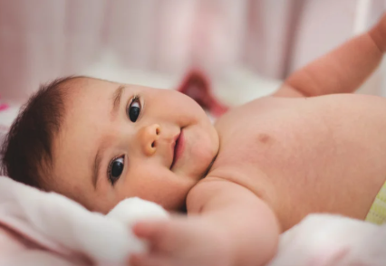 Newborn receiving gentle chiropractic care