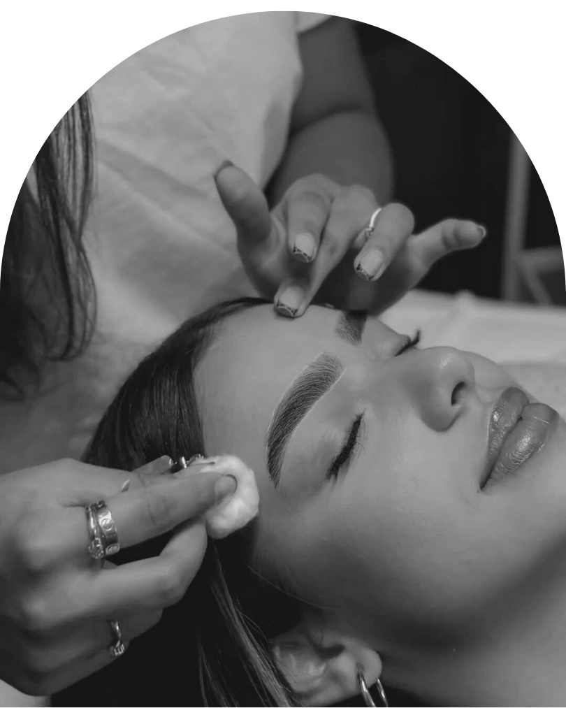 Woman getting brows and lashes done professionally in West Auckland