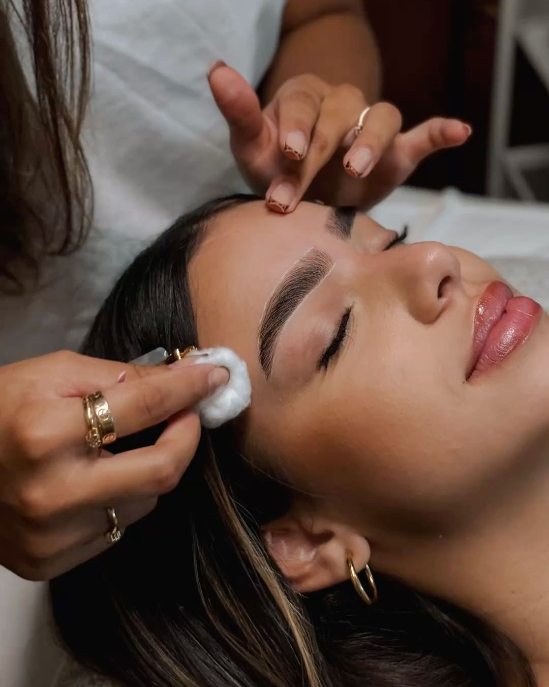 Woman getting ombre powder brows in west auckland