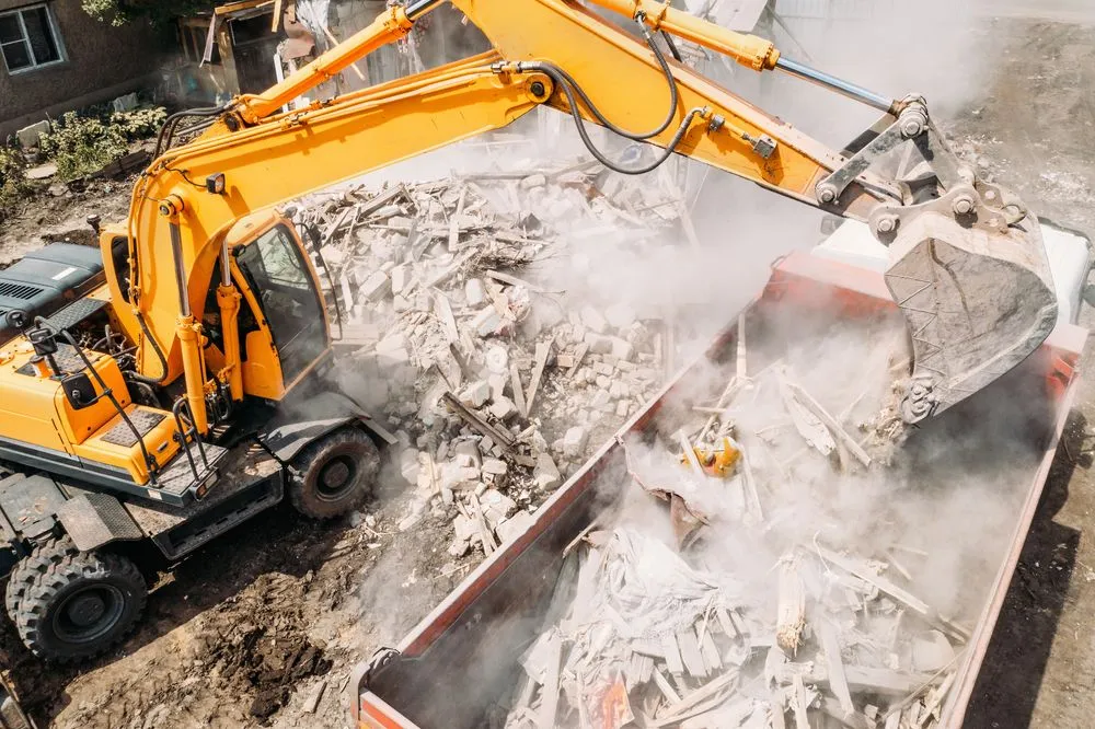 Demolition debris being loaded into a truck