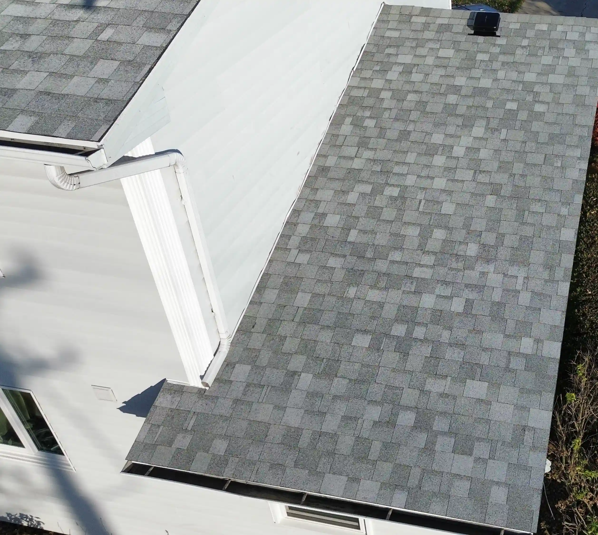 Roof with severe storm damage and missing shingles in Georgetown, TX before restoration