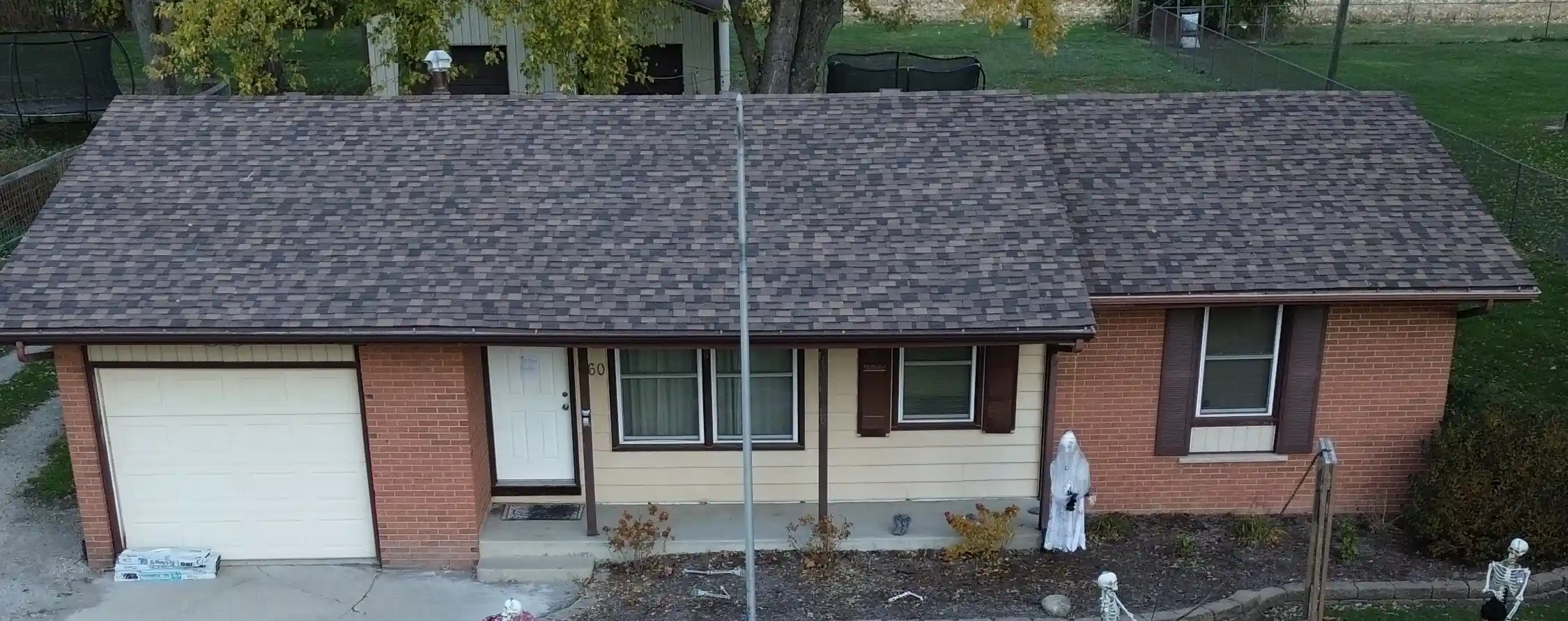 Roof with severe storm damage and missing shingles in Georgetown, TX before restoration