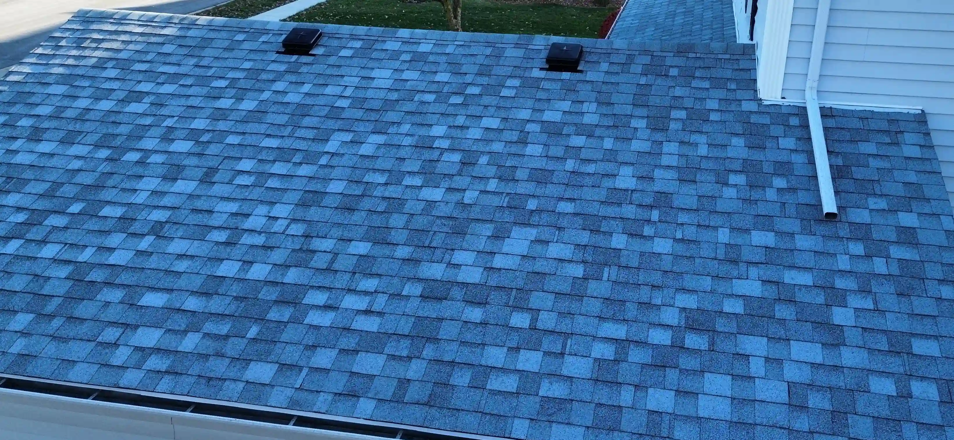 Roof with severe storm damage and missing shingles in Georgetown, TX before restoration