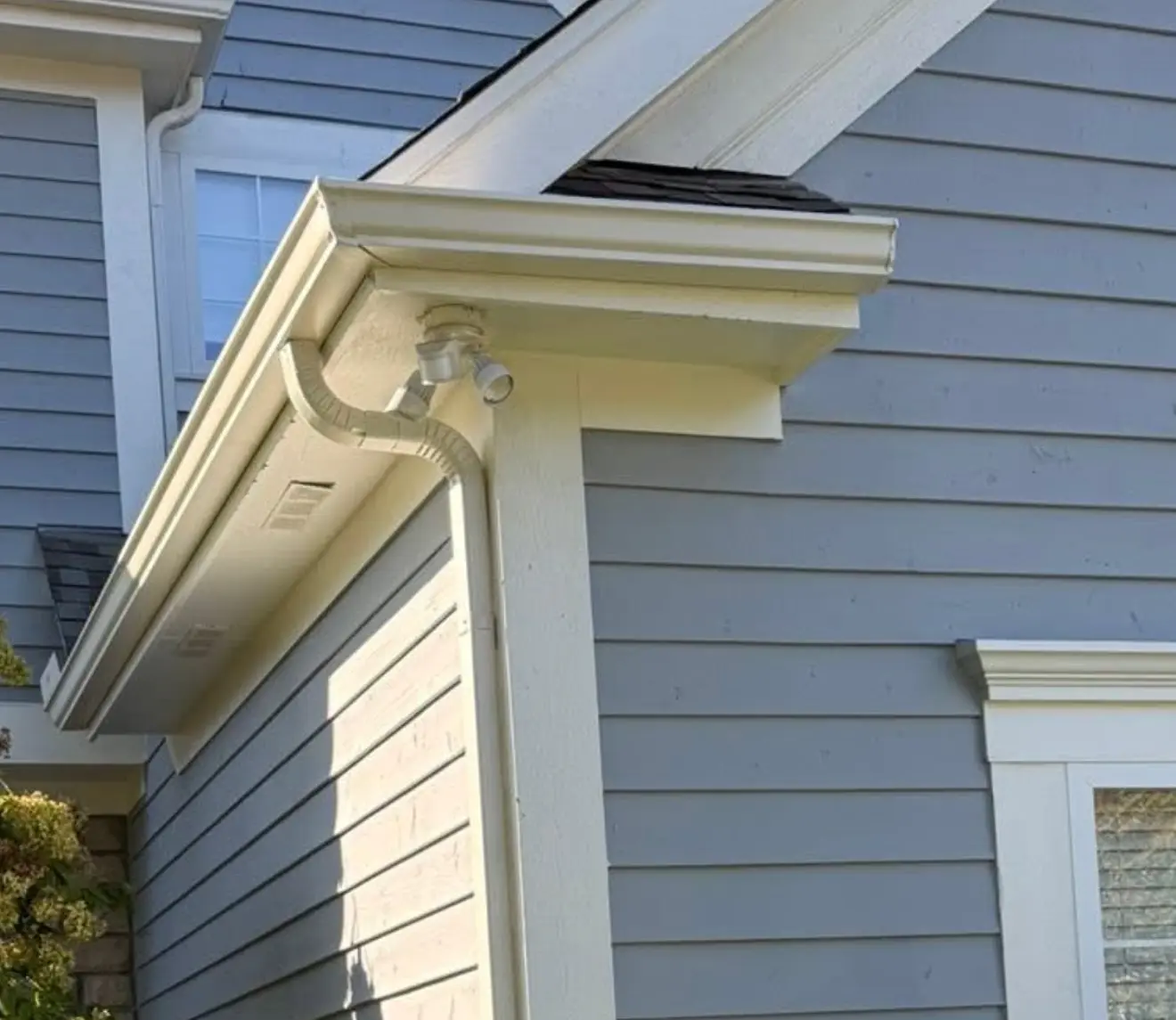 Residential gutter system directing rainwater away from the foundation to prevent water damage and structural issues