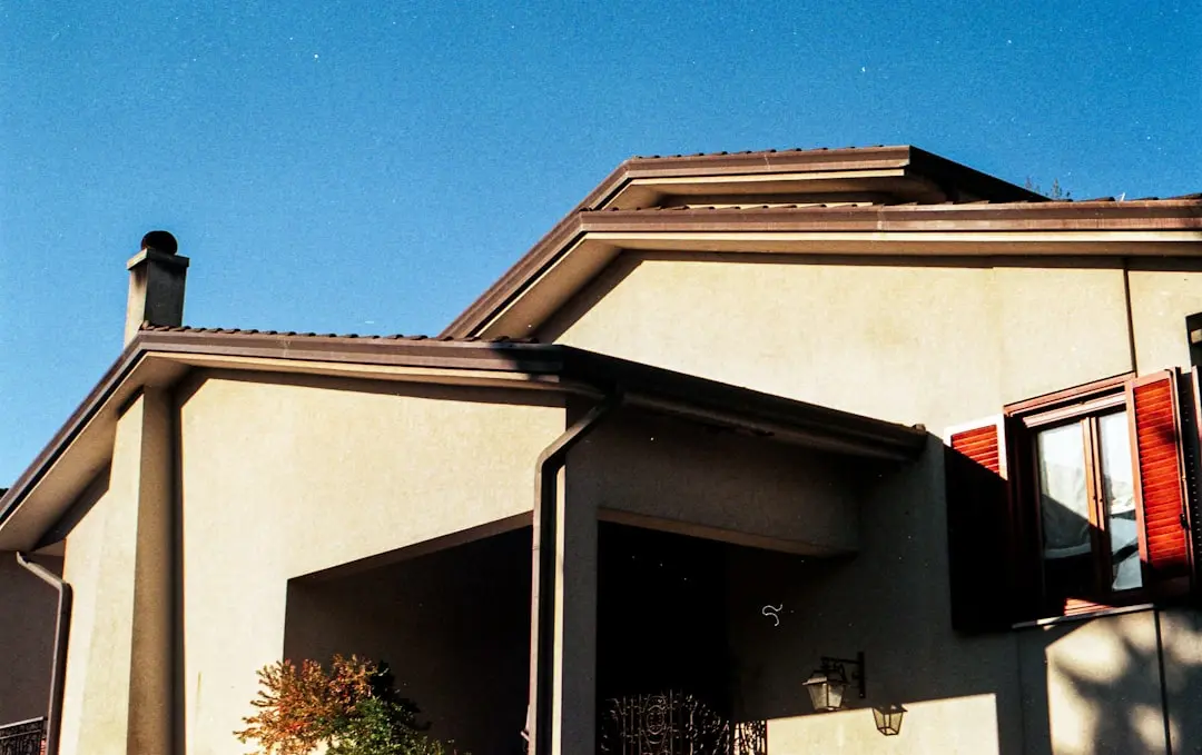 Residential gutter guard installation reducing debris buildup preventing clogs and lowering ongoing gutter maintenance needs