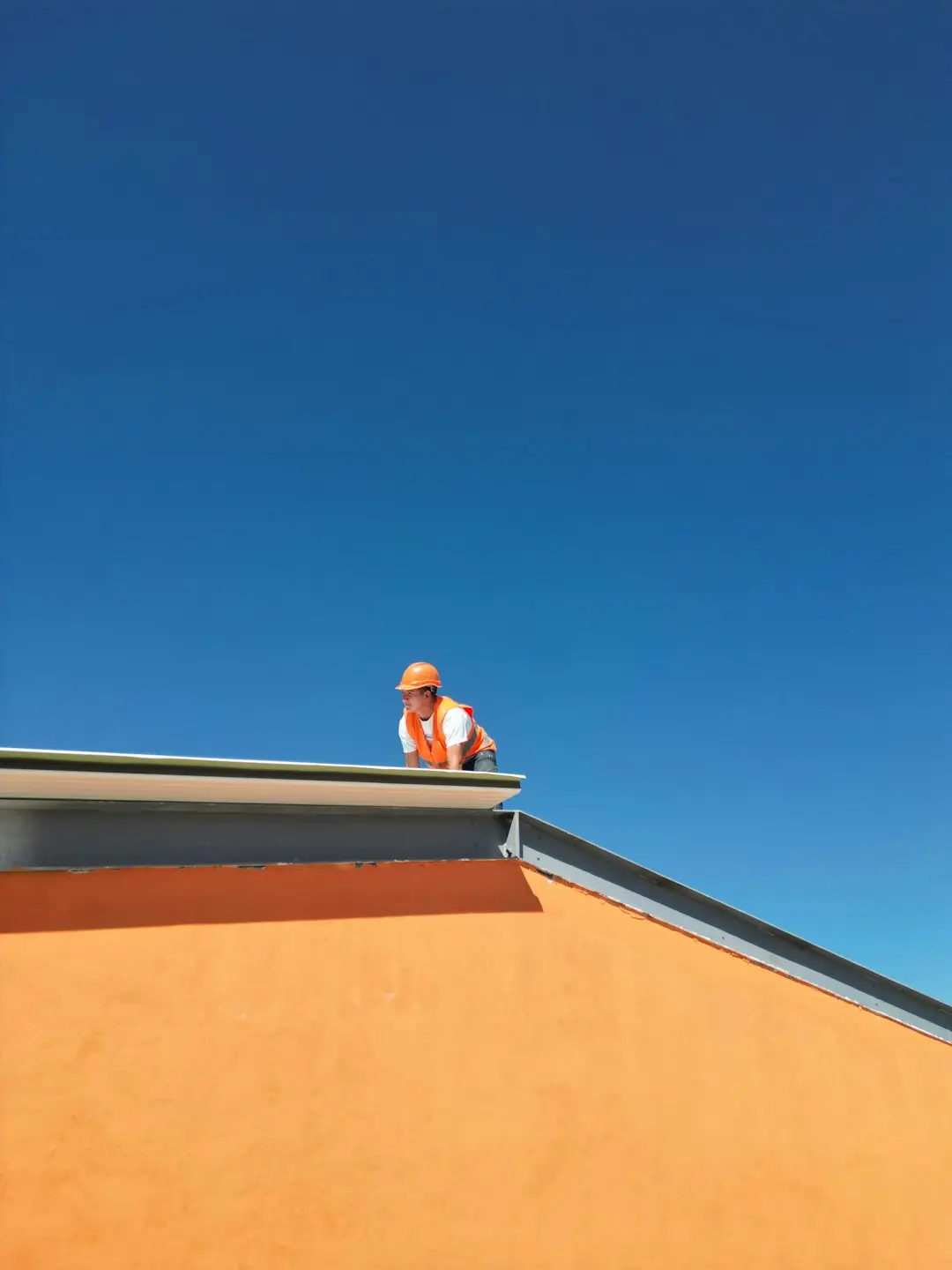 Professional roofing contractor performing roof inspection and repair on a residential property to ensure long term protection and reliable roofing performance