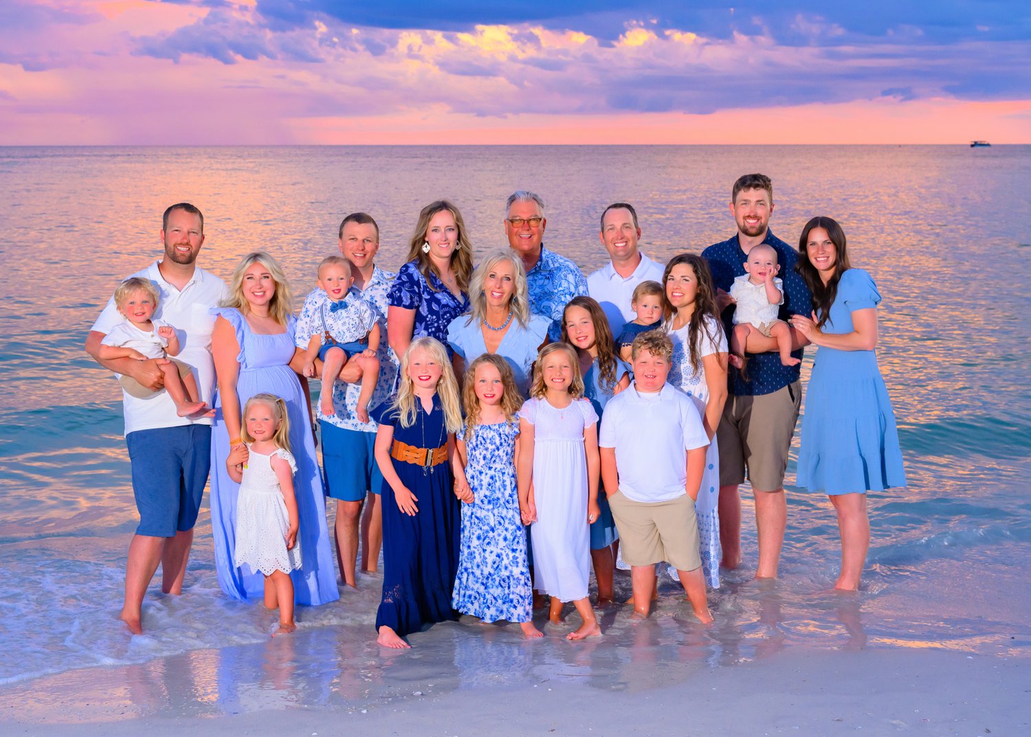 Three-generation family portrait at sunset on a Southwest Florida beach