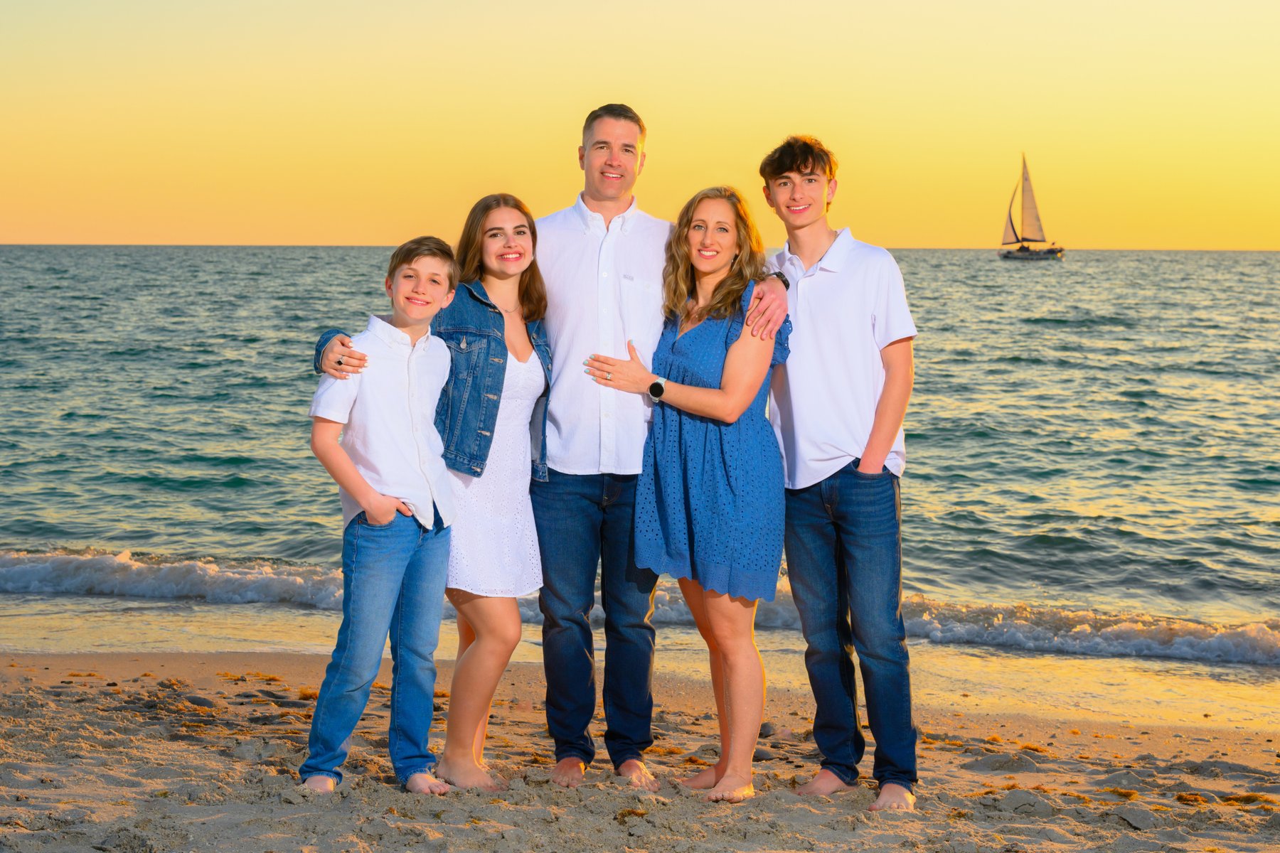 Family at golden hour on a Gulf Coast beach at sunset