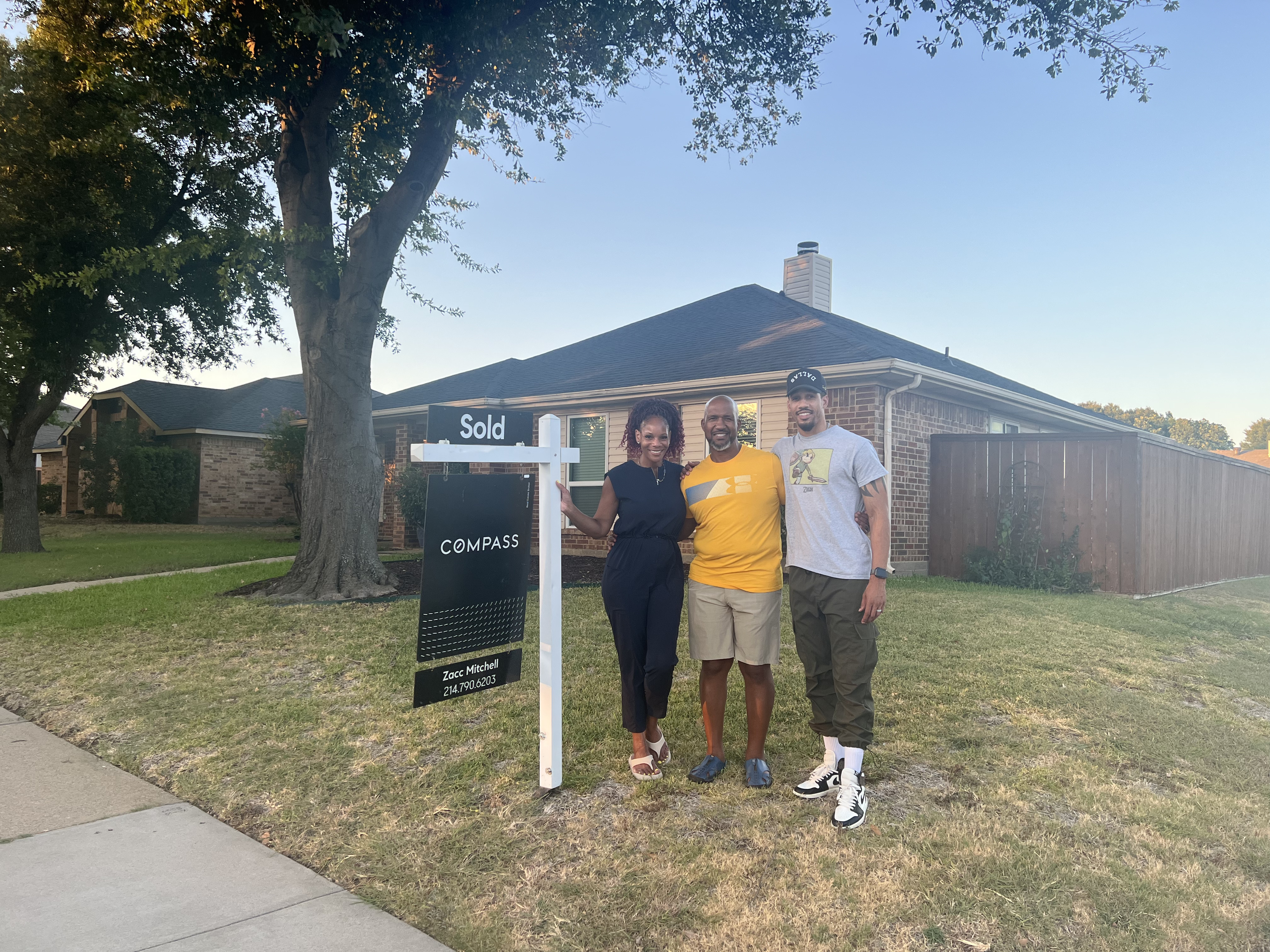 Zacc Mitchell with his family after closing on their new home in the DFW metroplex