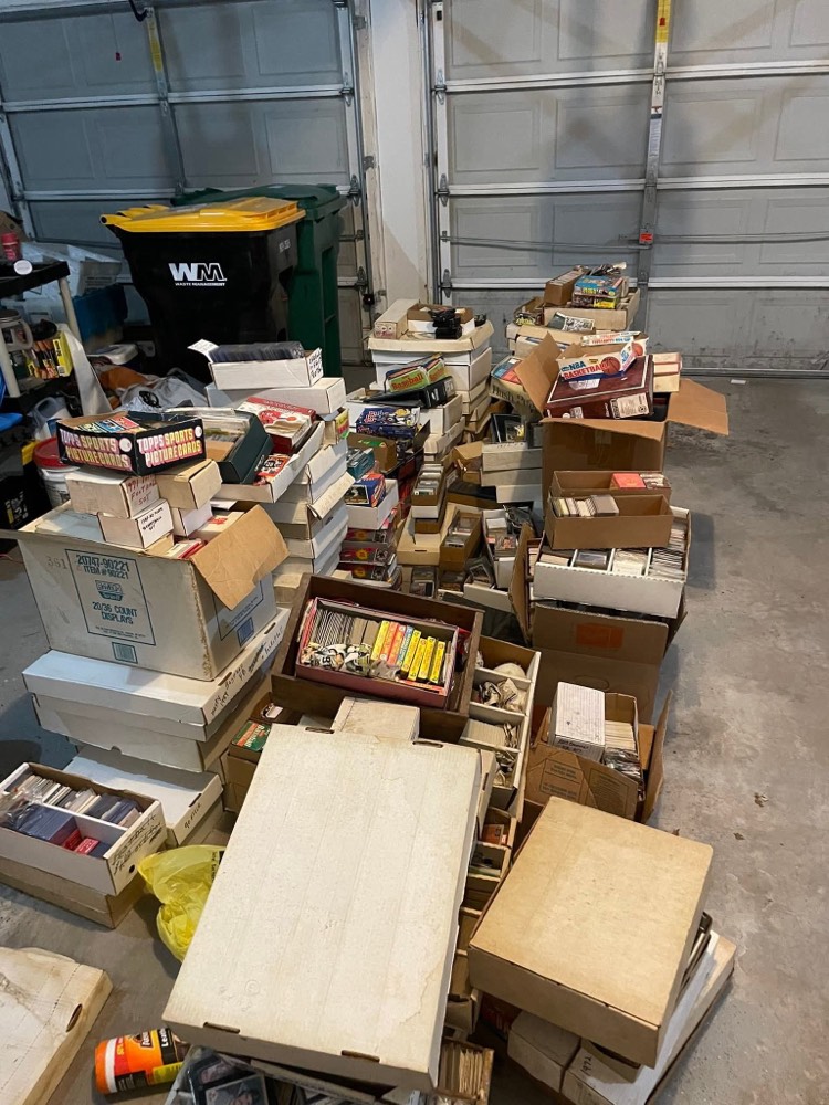 An estate collection of cards in a garage