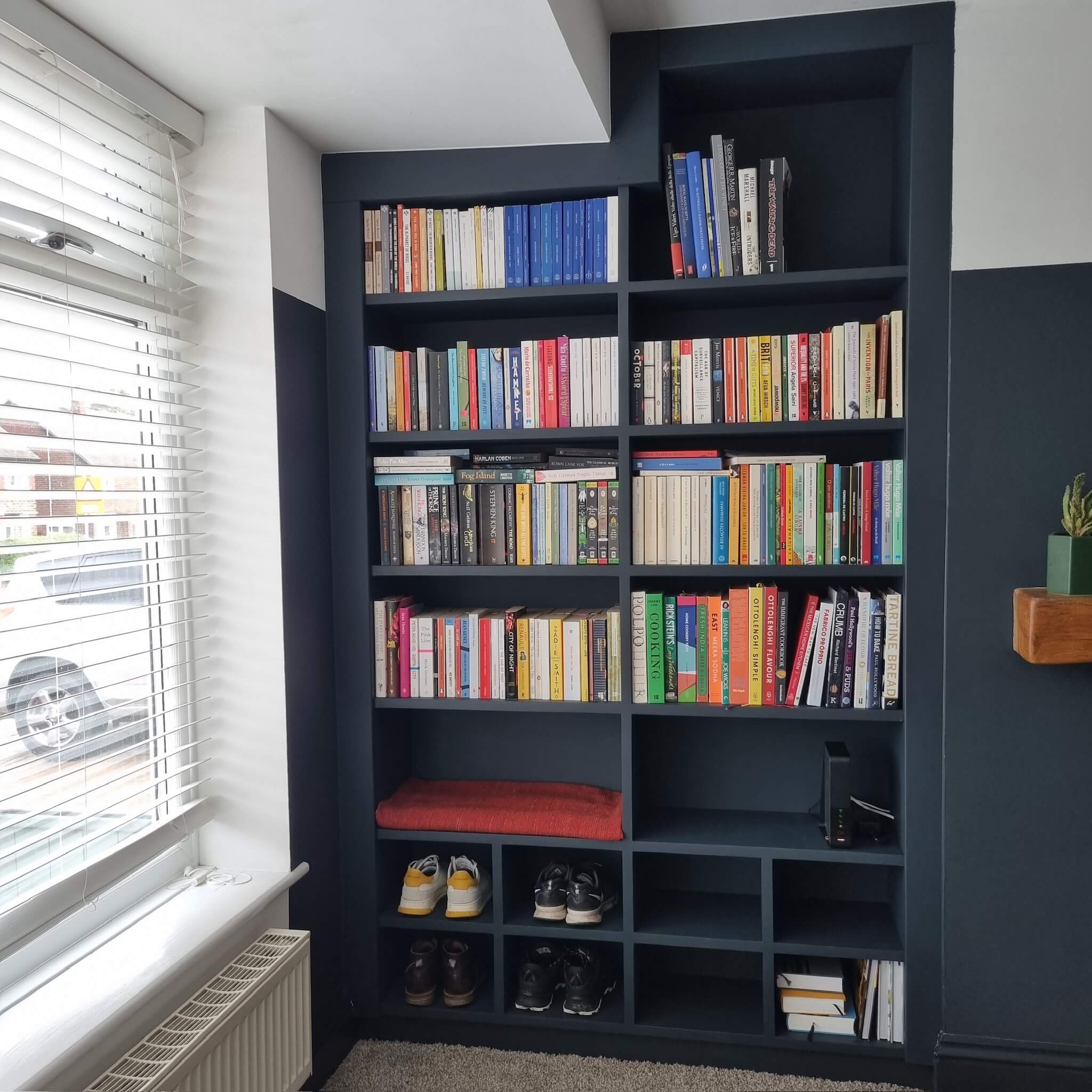 Custom media wall with integrated TV unit and storage, designed by JAX Bespoke