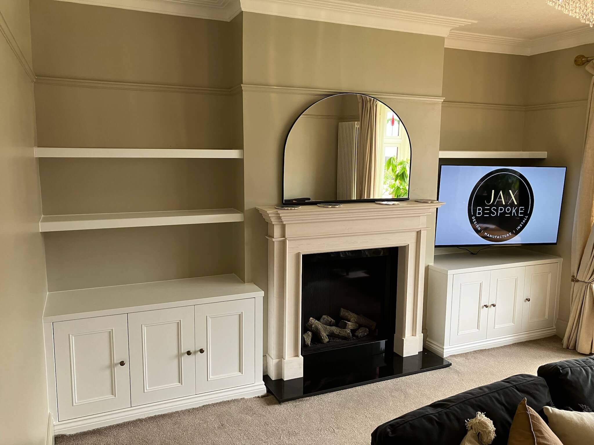 Custom fitted alcove shelving and cabinetry filling a chimney breast recess in a Leeds period home, by JAX Bespoke