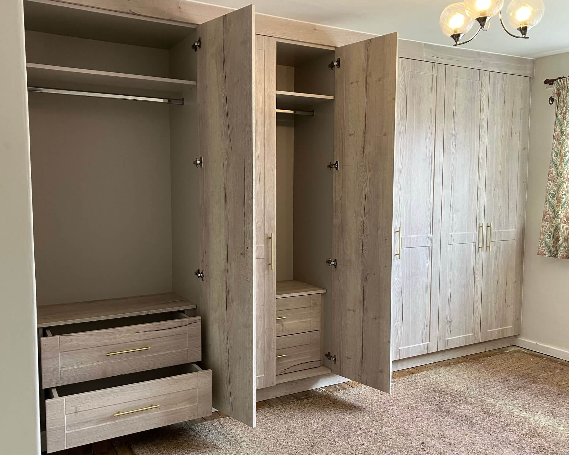 Oak wardrobe interior with shaker drawers and hanging rails by JAX Bespoke — Horbury, Wakefield