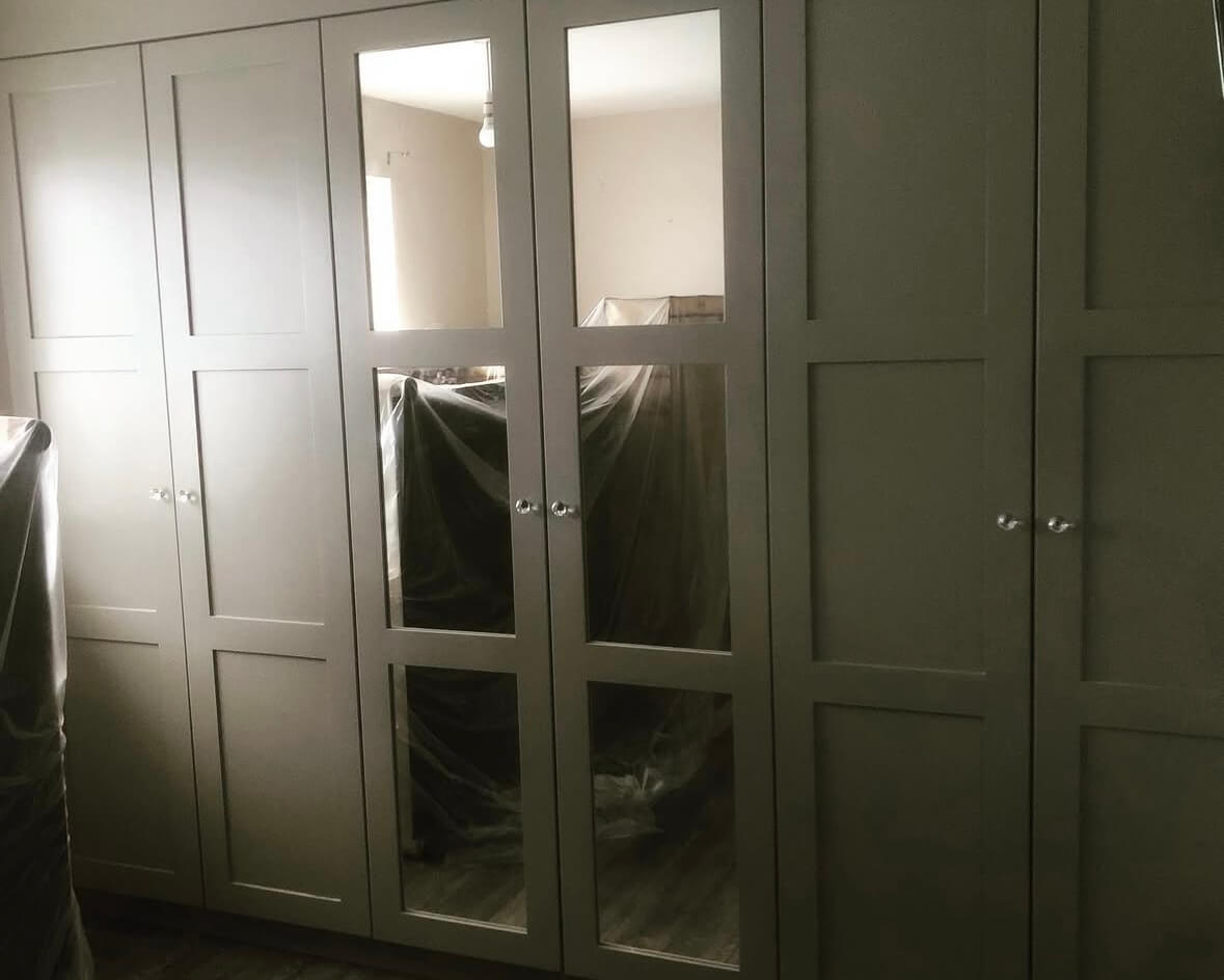 Three panelled shaker style bespoke wardrobe with mirrored doors by JAX Bespoke — Skipton, North Yorkshire