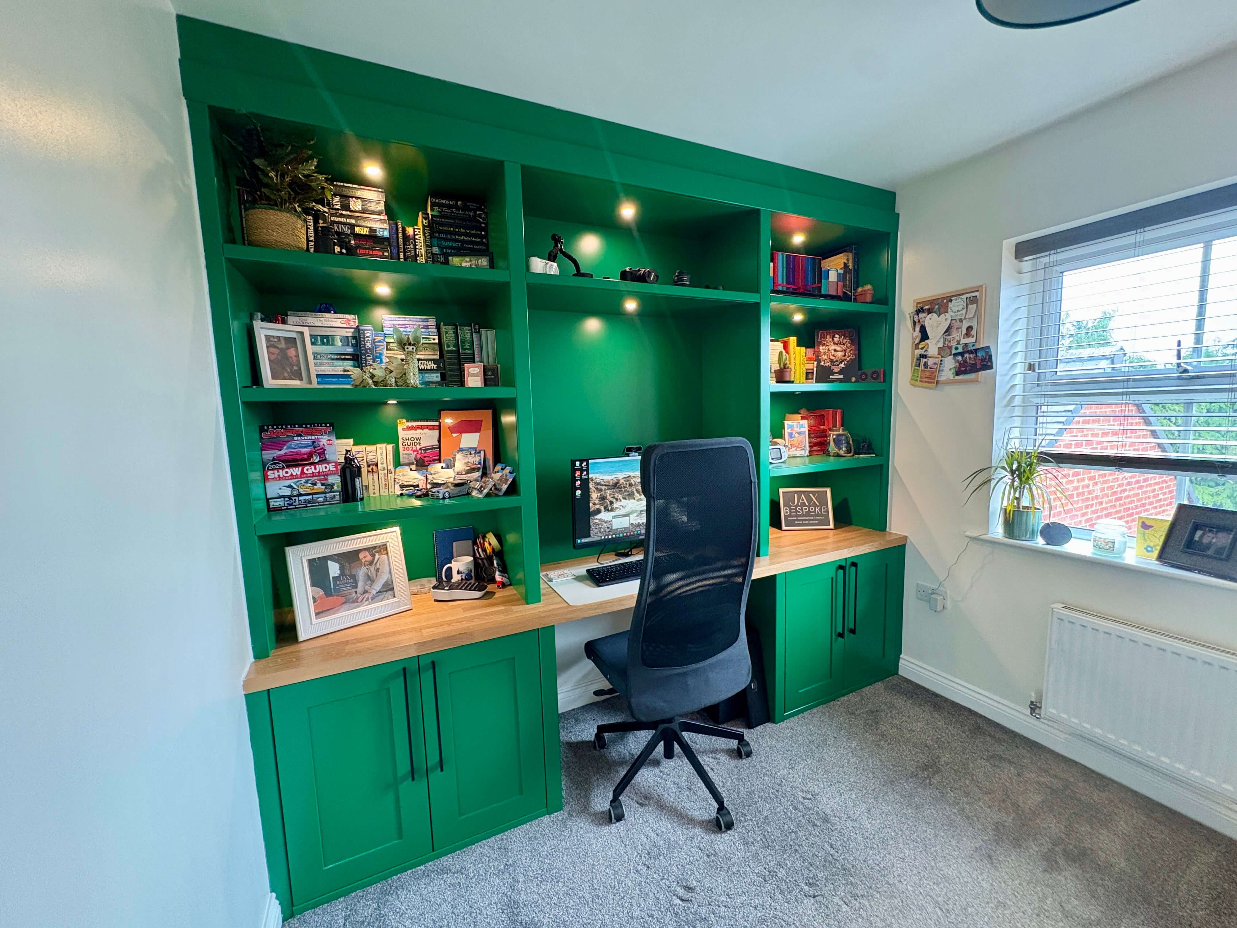 Green full-wall fitted home office with integrated shelving, desk and cabinetry, a real JAX Bespoke Yorkshire installation