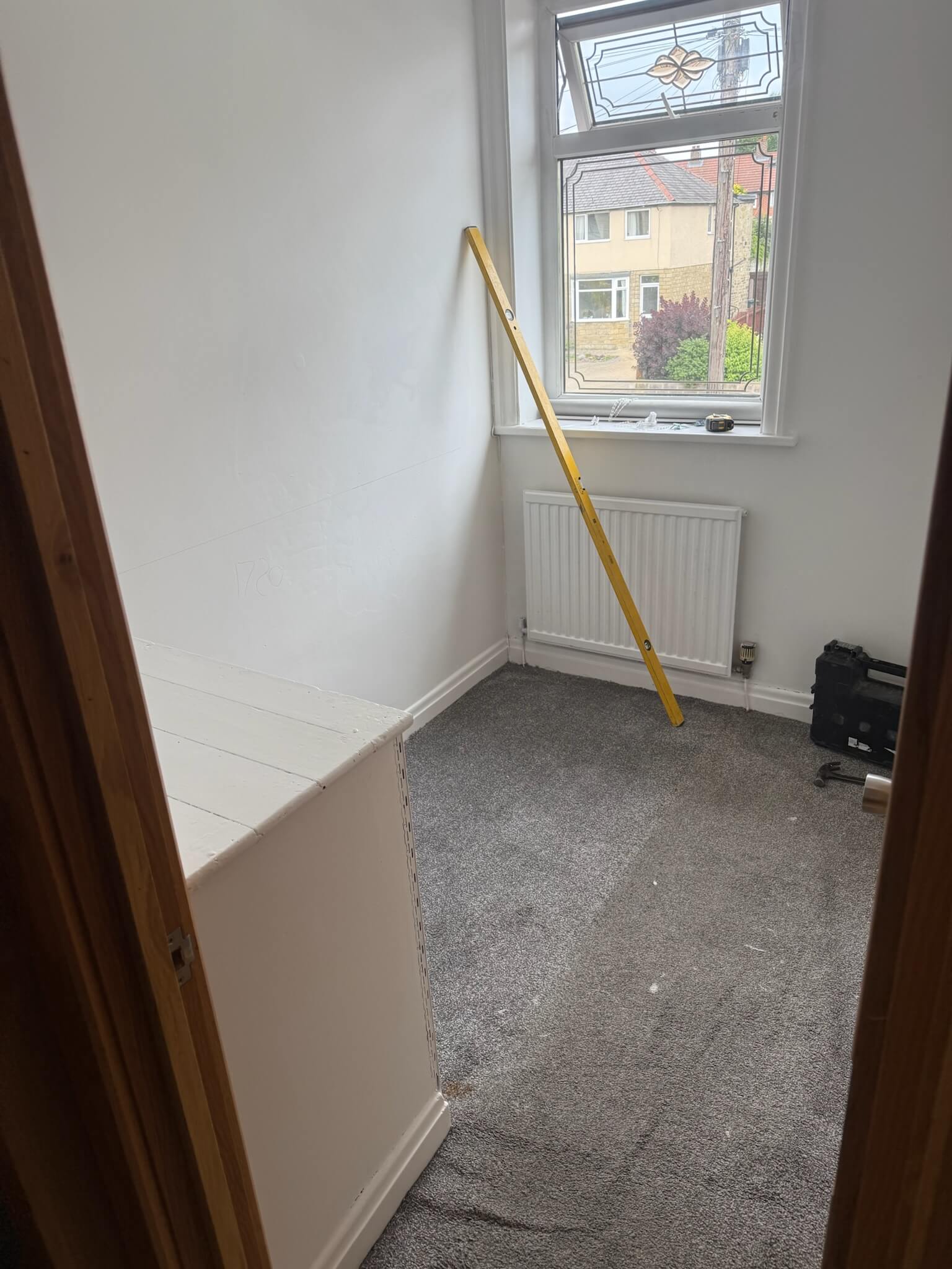 Small Wakefield bedroom before bespoke storage, dominated by an exposed bulkhead