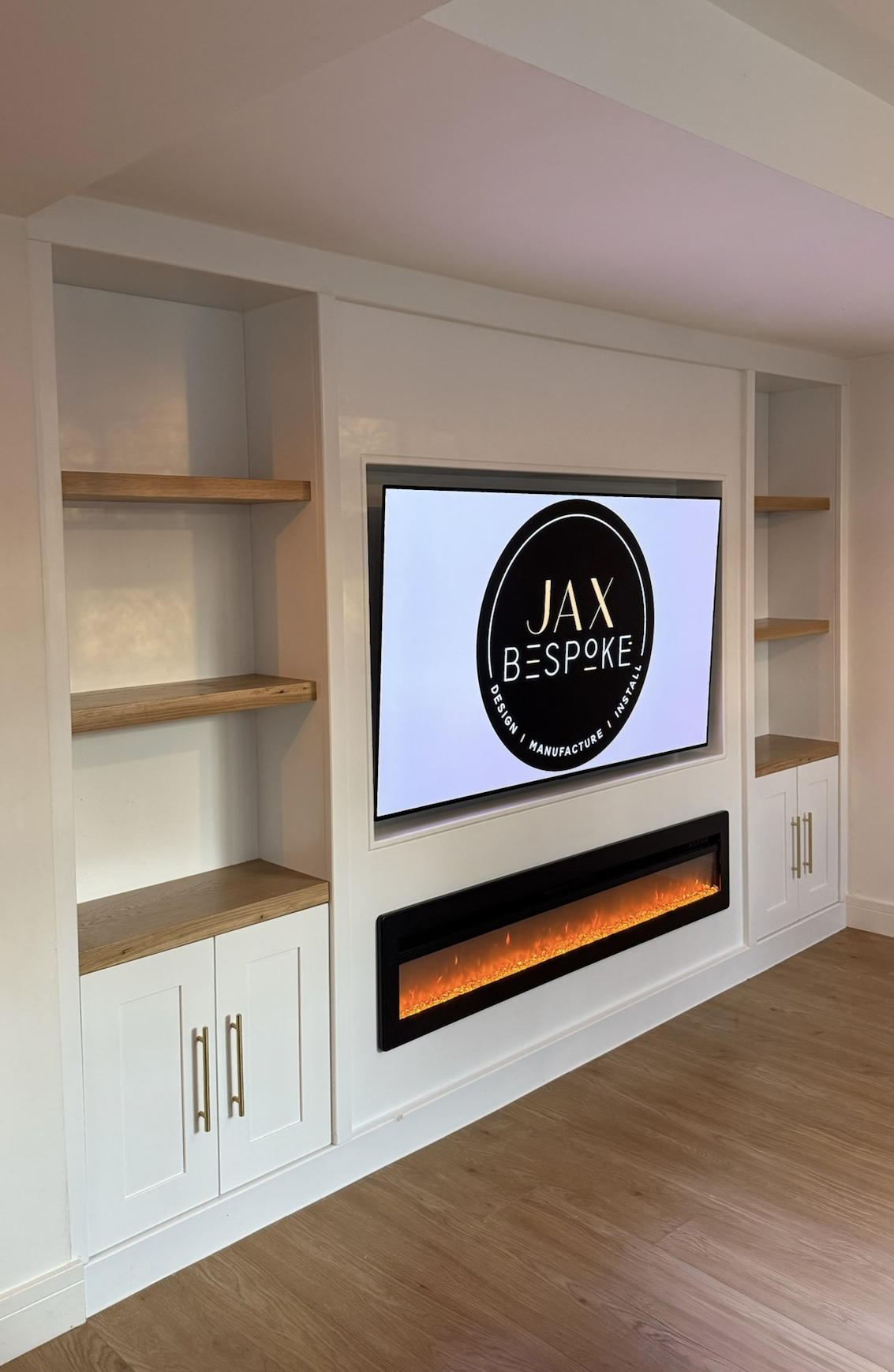 Bespoke media wall with integrated TV unit, storage and decorative shelving for a Leeds living room, by JAX Bespoke