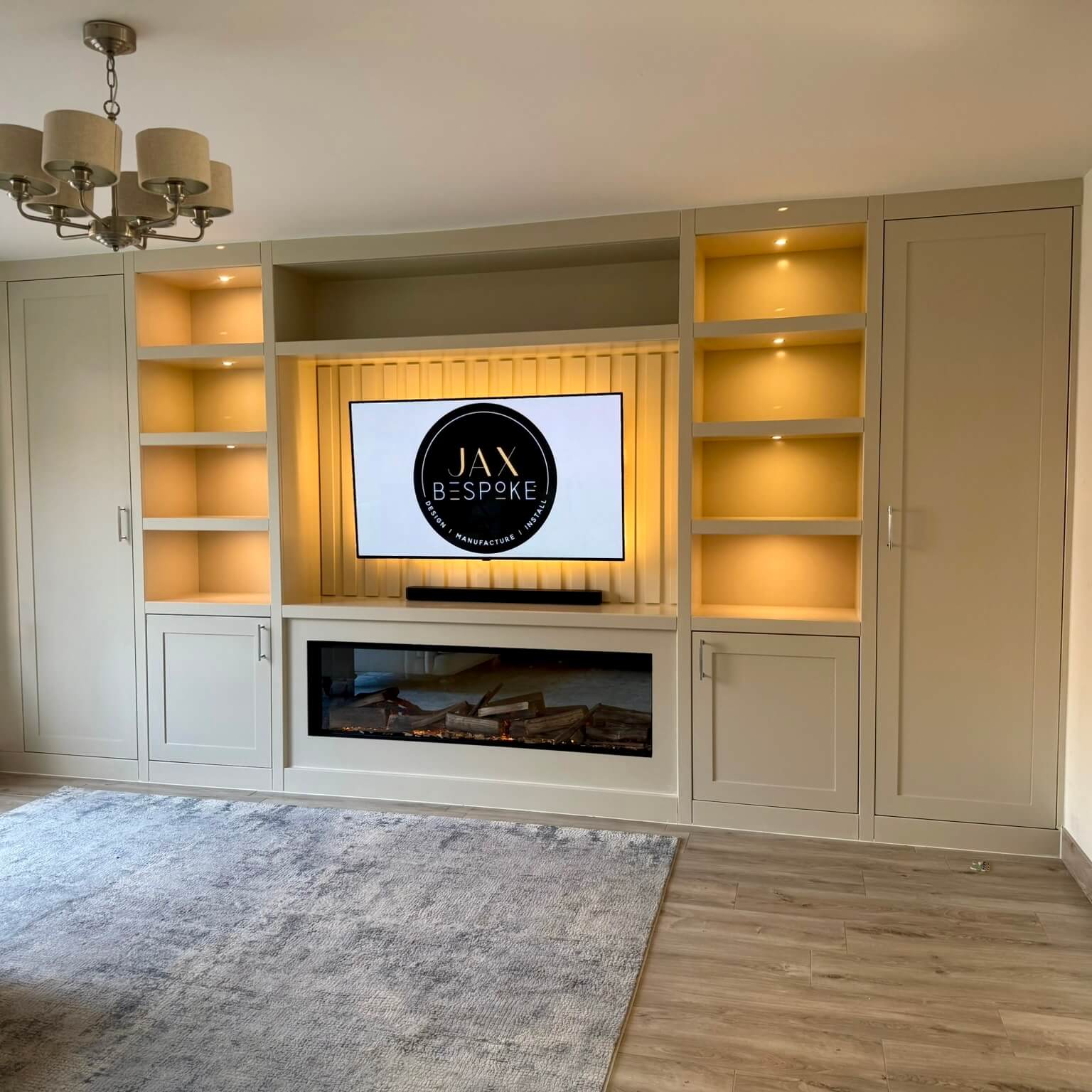 Custom bespoke media wall with integrated TV unit and storage, designed by JAX Bespoke