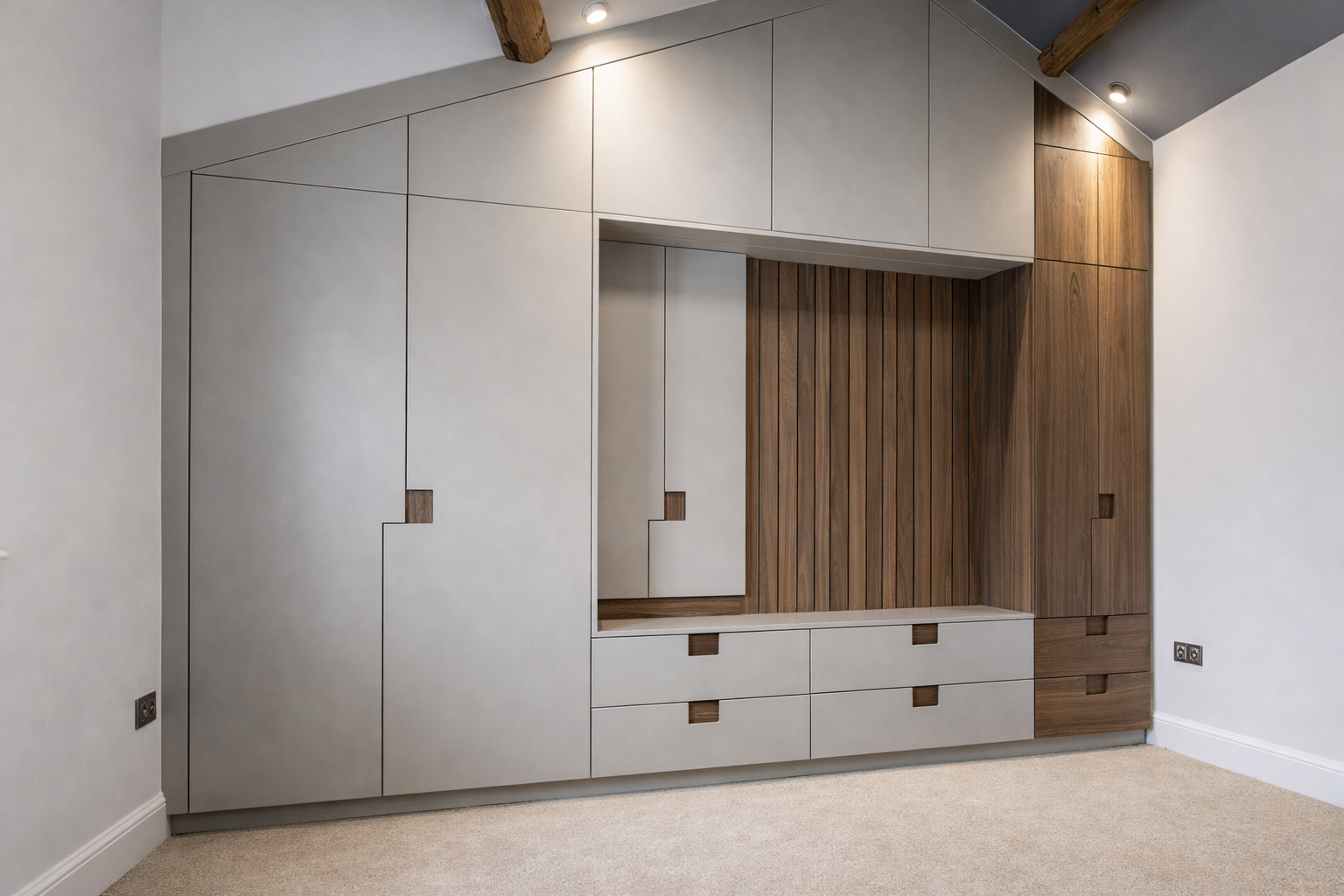 bespoke fitted wardrobes with integrated drawers and central dressing area modern bedroom storage UK