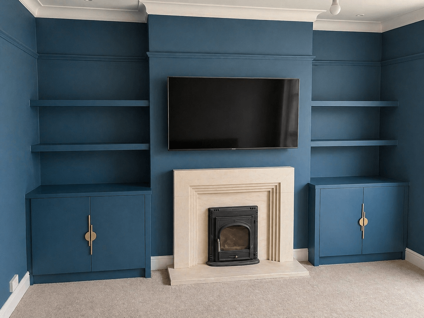 Custom fitted alcove shelving and cabinetry built precisely into a period York home, by JAX Bespoke