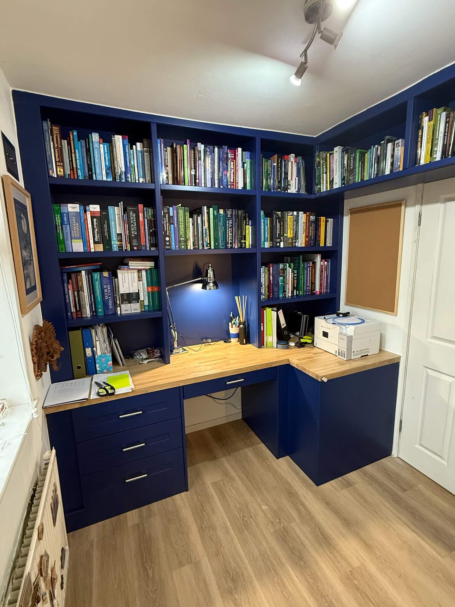 Bespoke fitted home office with integrated desk, shelving and concealed storage, designed and built by JAX Bespoke