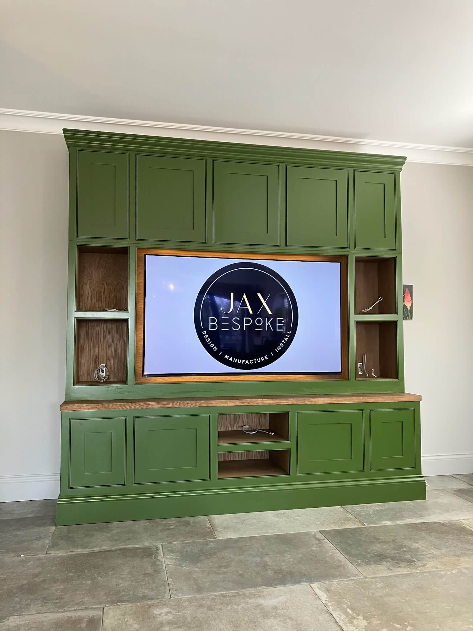 Bespoke media wall with integrated TV unit, storage and decorative shelving, designed for a York living room by JAX Bespoke