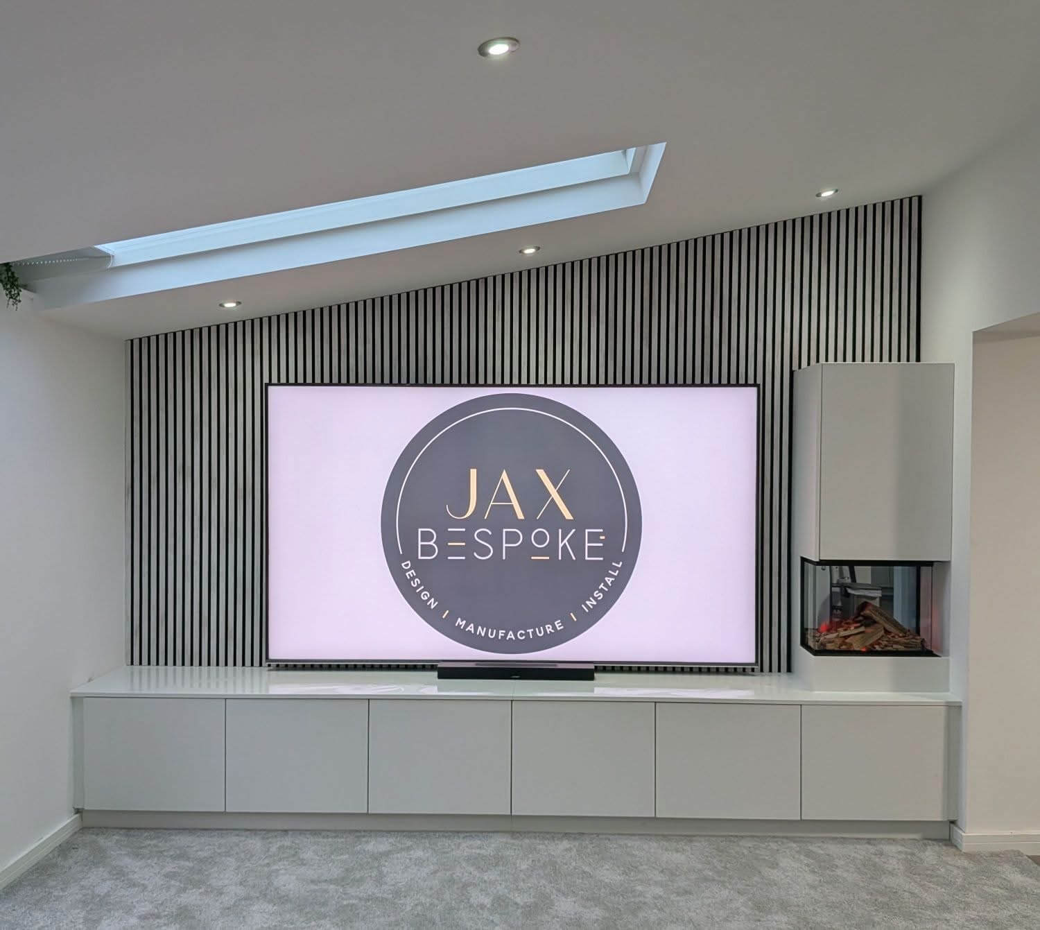 Bespoke media wall with integrated TV unit, storage and shelving designed for a Sheffield living room, by JAX Bespoke