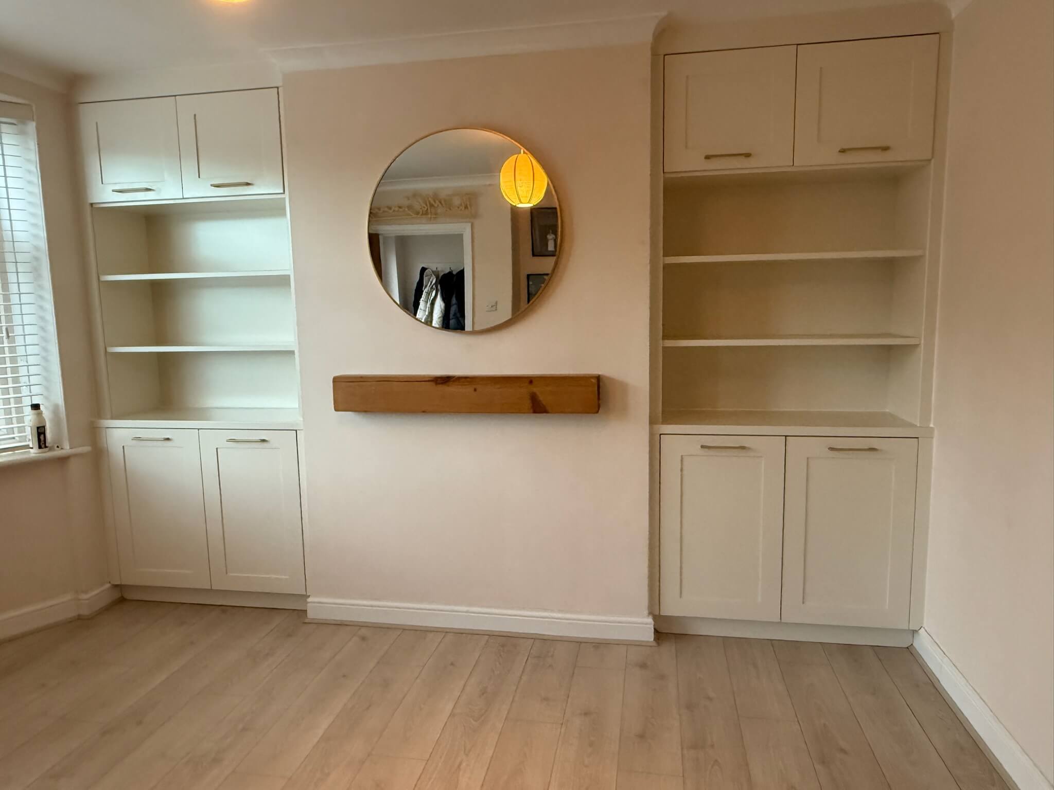 Custom fitted alcove shelving and cabinetry built into a chimney breast recess, designed and installed by JAX Bespoke