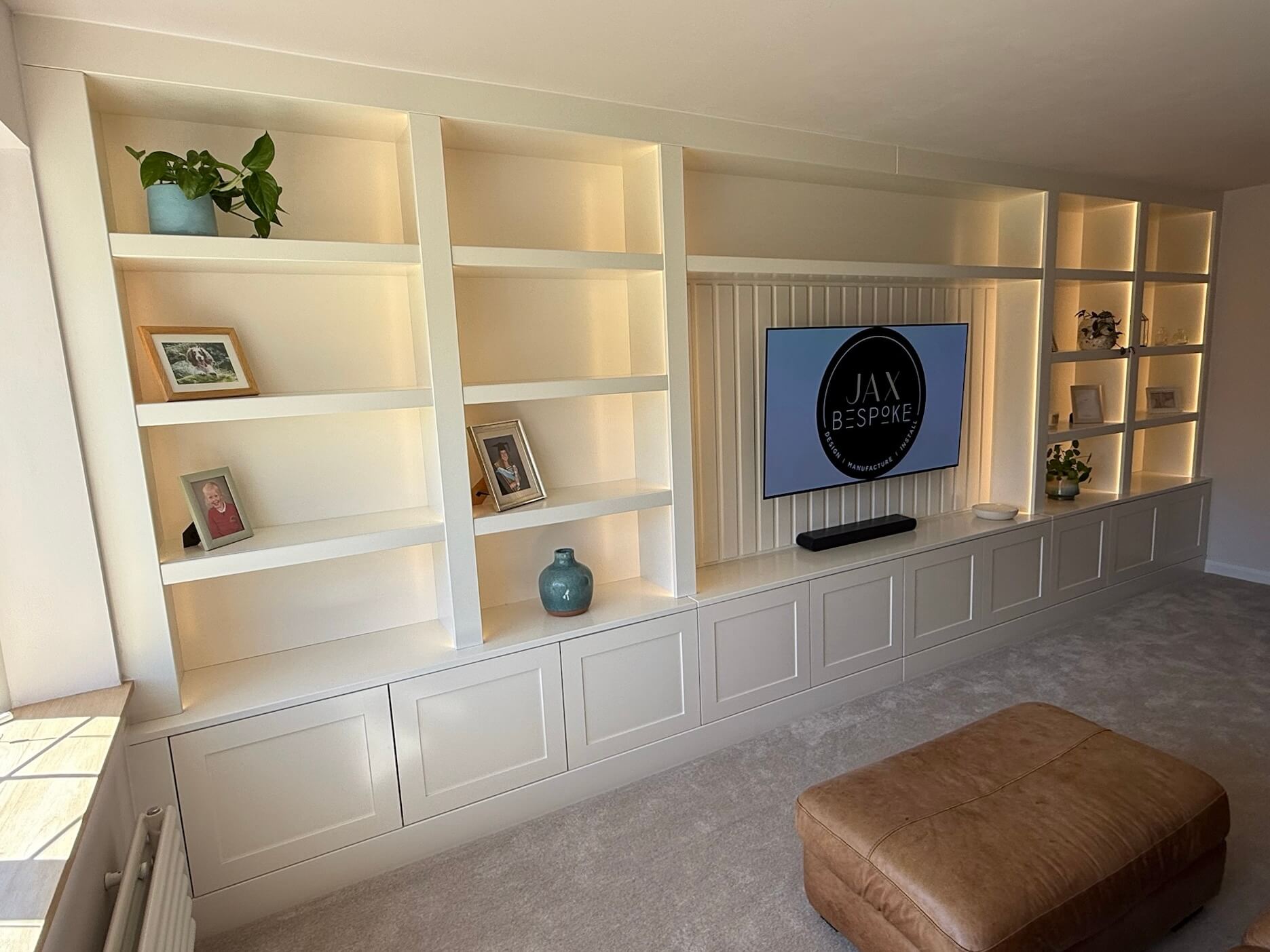 Floor-to-ceiling bespoke cabinetry media wall filling the full wall height, designed and built by JAX Bespoke Yorkshire