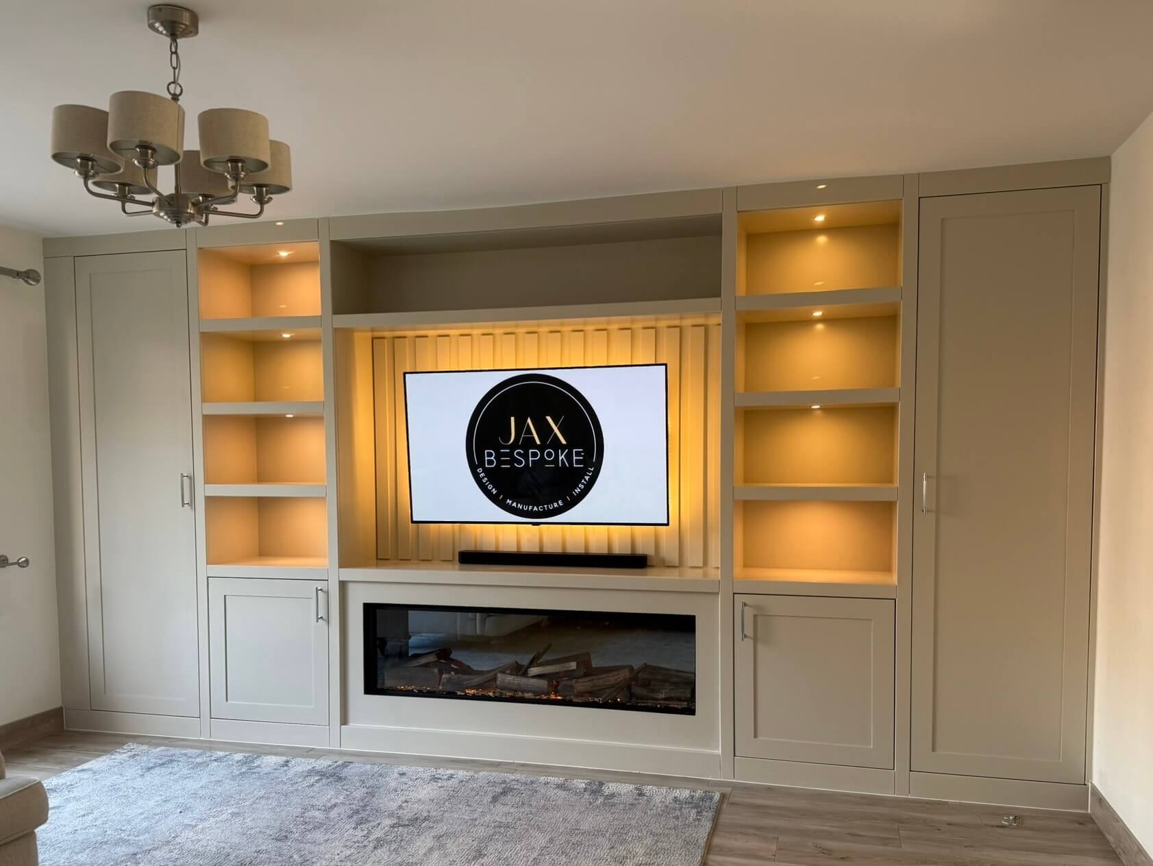 Bespoke cabinetry media wall with integrated electric fire, handcrafted and installed by JAX Bespoke Yorkshire