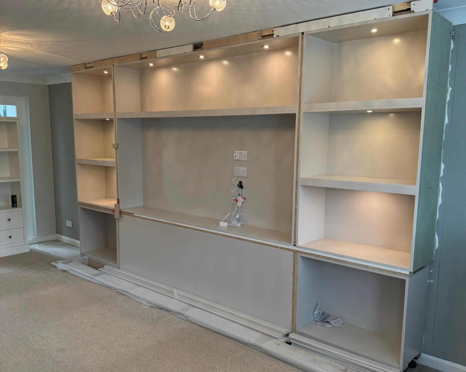 Bespoke cabinetry media wall during installation by JAX Bespoke Yorkshire