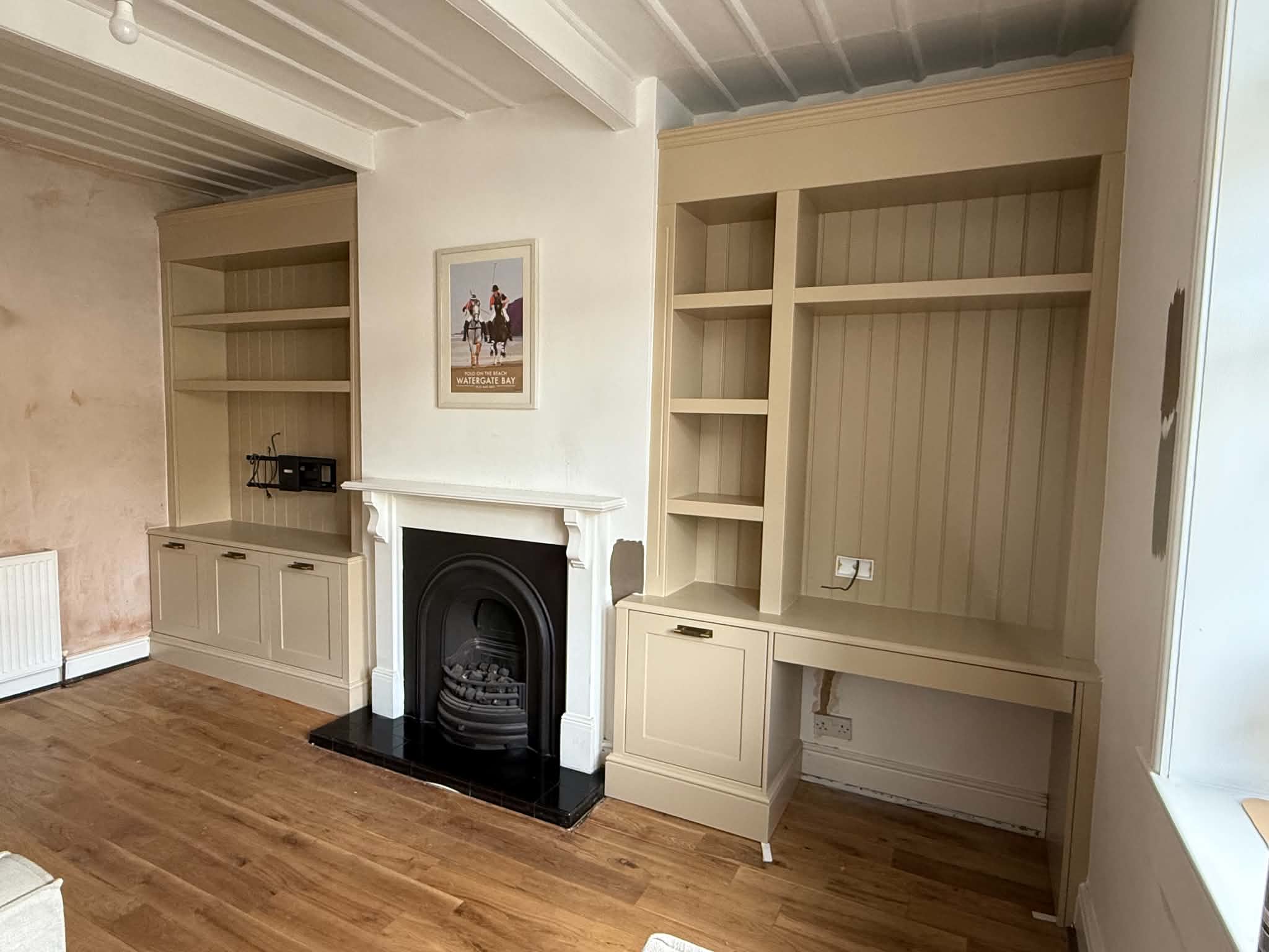 Traditional style bespoke alcove cabinetry fitted either side of a chimney breast in a period Yorkshire home, by JAX Bespoke