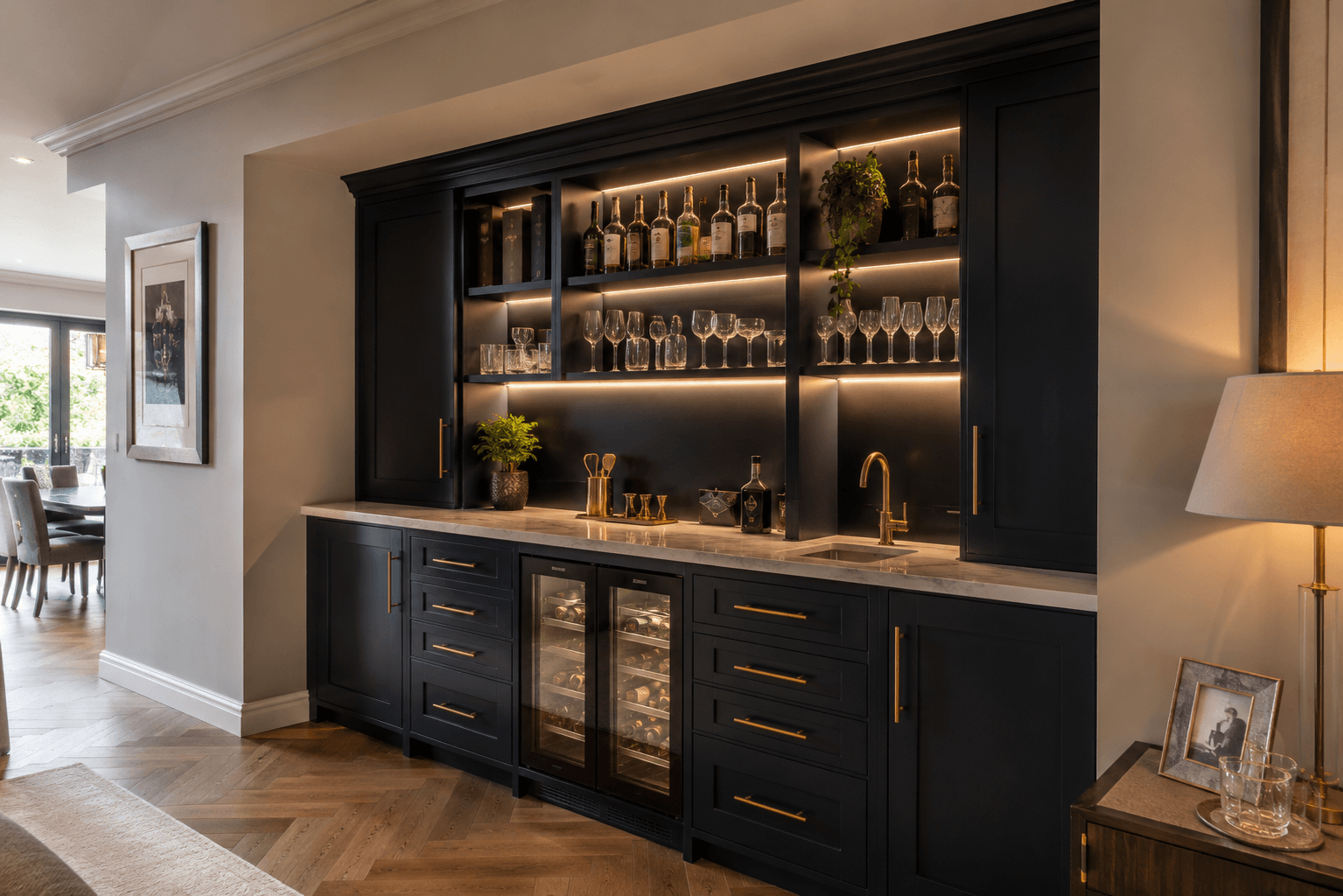 Statement fitted home bar with integrated sink, dual built-in wine fridges and marble worktop, designed as a feature piece by JAX Bespoke