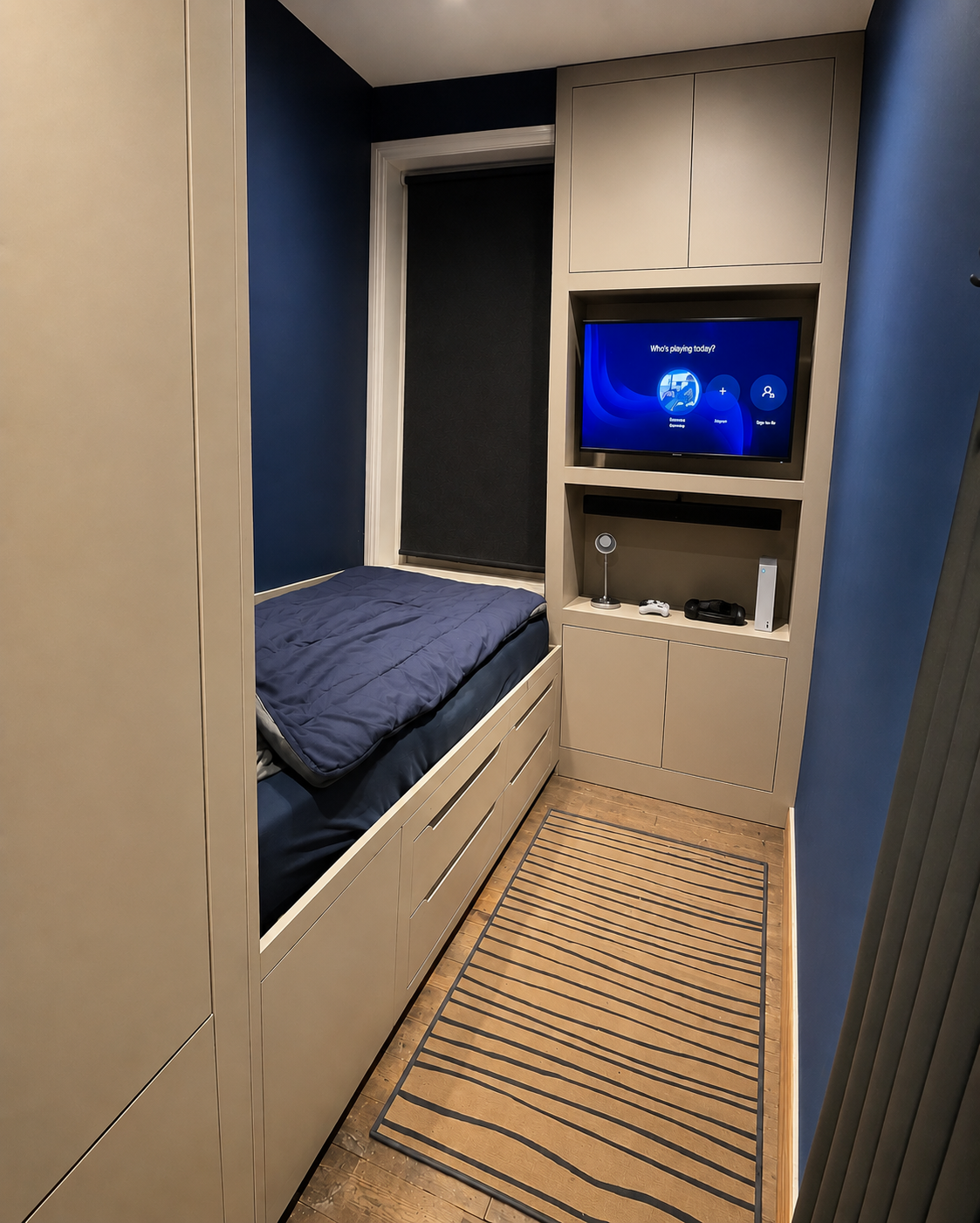 Bespoke storage built around a bulkhead in a box bedroom, by JAX Bespoke