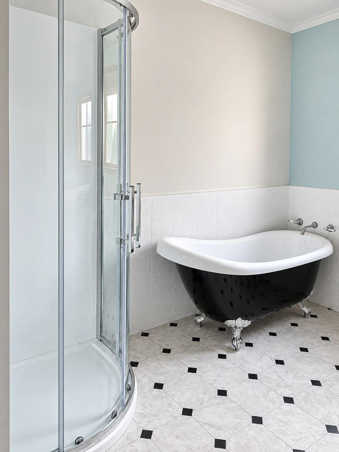 Bathroom with black clawfoot bathtub and curved shower