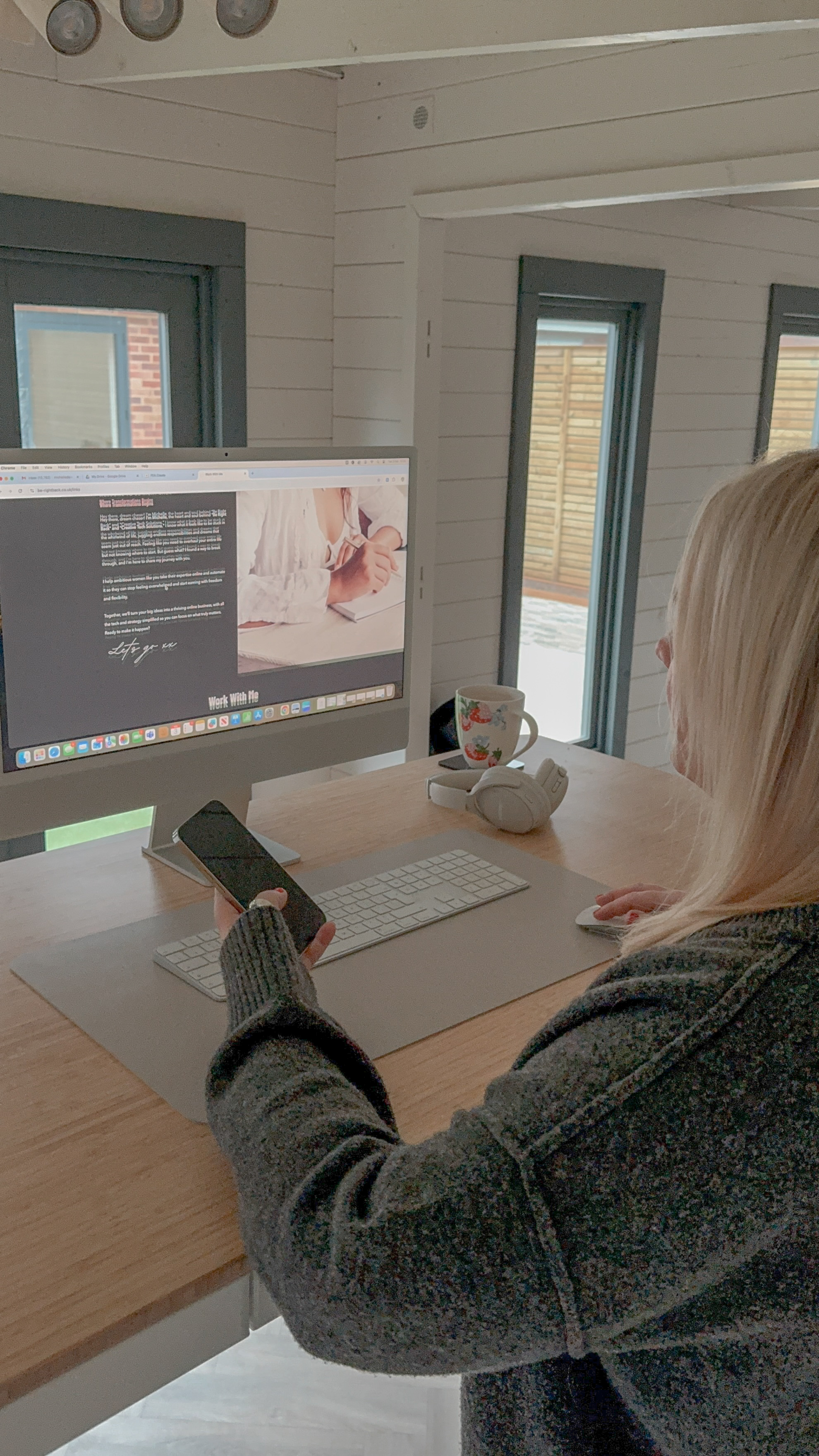 Michelle, UK-based GoHighLevel mentor from Be Right Back, working at her desk on a website.