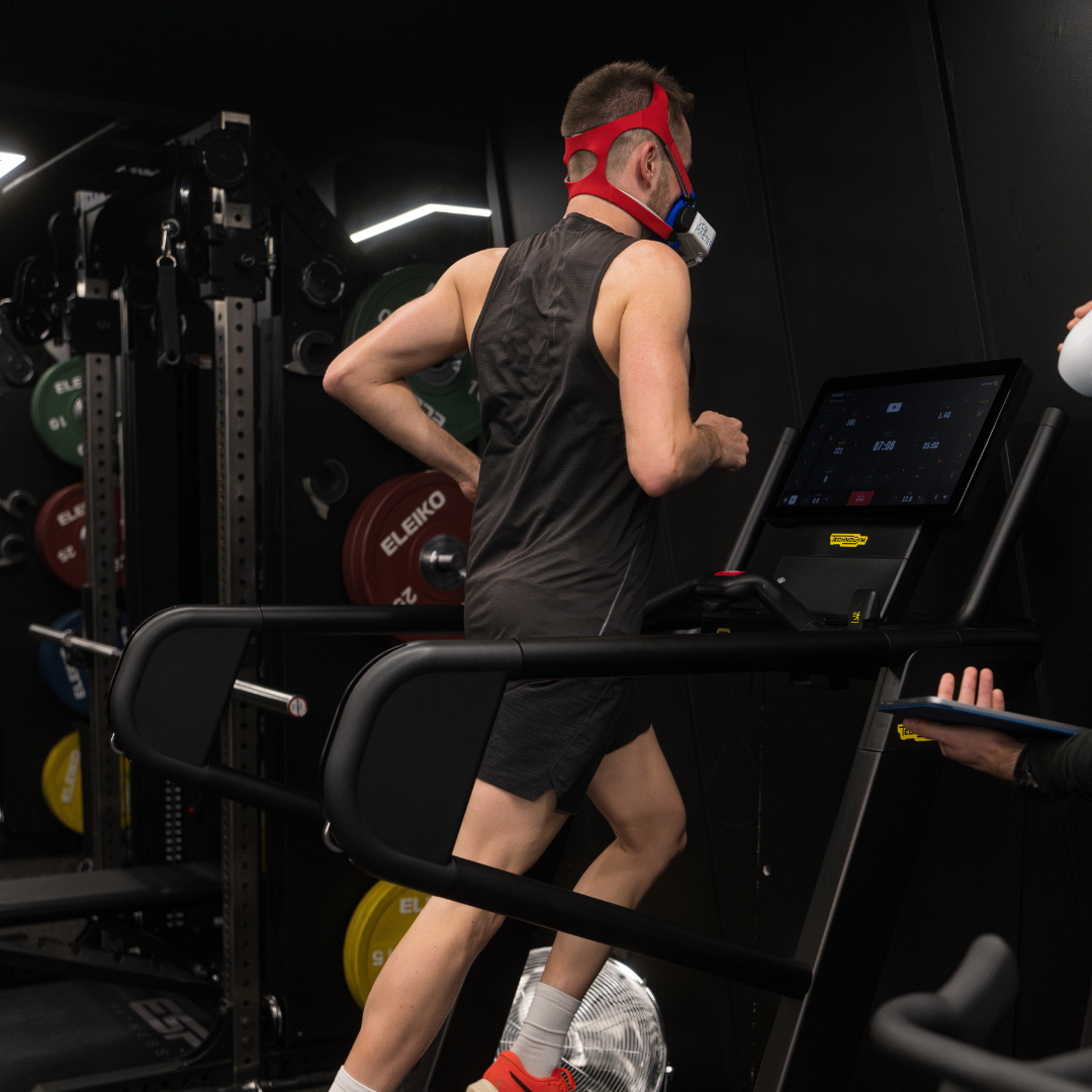 Athlete undergoing a treadmill running gait assessment