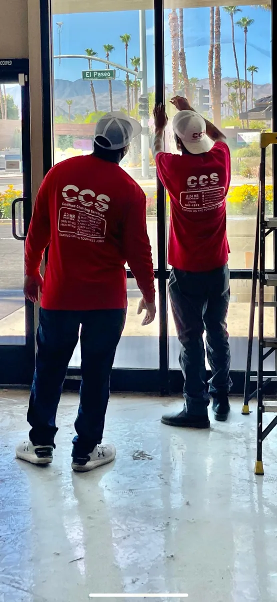 CCS employees cleaning commercial storefront windows