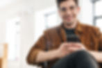 Man viewing veterinary social media on mobile phone.