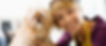 Woman with dog on veterinary social media page.