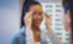 Woman trying on glasses found on Optometrist website.