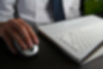 Man using mouse to click vet SEO keywords