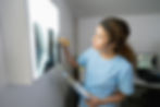 Veterinarian reading x-rays for veterinary telemedicine