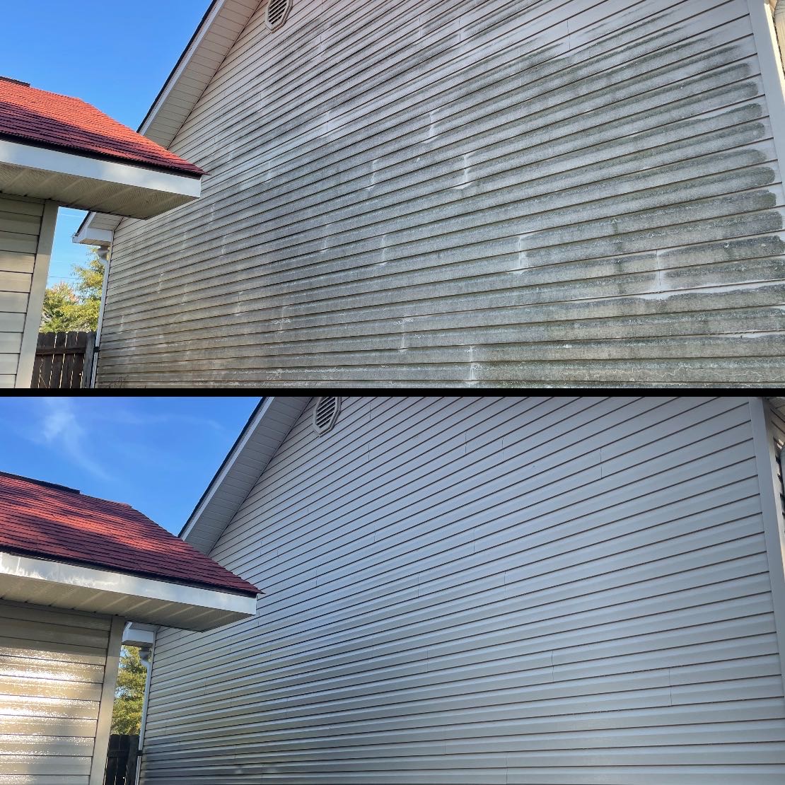 Before and after of residential vinyl siding: algae streaked panels above, clean panels below